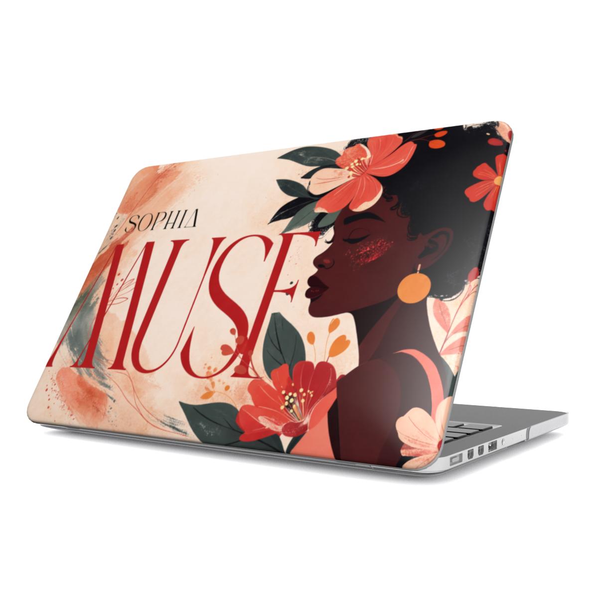 A personalized MacBook case on a white background, featuring a vibrant illustration of a Black woman with coral flowers, custom typography "SOPHIA MUSE," and a warm neutral background with the Apple logo.
