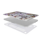 An exploded 3D view of a MacBook case kit with a unique floral tech design. The top printed shell shows the lavender and circuit board pattern, followed by the silver laptop, and a clear, vented bottom shell for cooling.