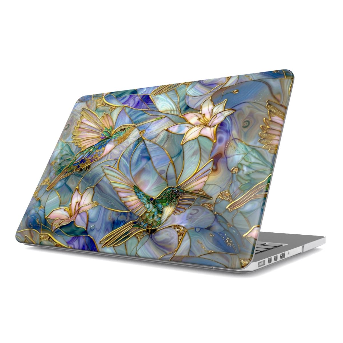 Angled view of a MacBook featuring a protective hard shell case with an intricate stained glass hummingbird design. The artwork displays two vibrant hummingbirds in shades of emerald green and turquoise hovering near delicate lilies, with iridescent mosaic patterns and gold-accented outlines creating a 3D visual effect.