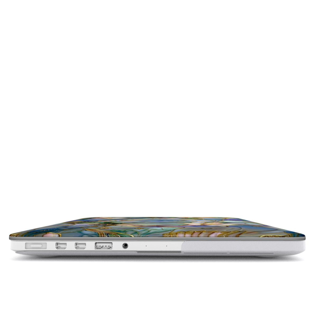 Side profile view of a closed MacBook showing its slim ports and the precise fit of the protective hardshell case. The top cover displays the edge of the intricate stained glass mosaic design with a hummingbird wing and gold outlines against the silver laptop body.
