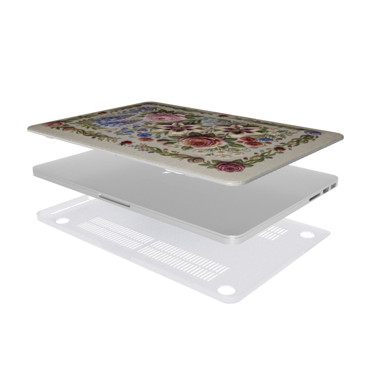 Exploded view of a two-piece MacBook hard shell case. The top piece features a vintage floral design with roses and wildflowers on a beige background. The middle shows a silver laptop, and the bottom piece is a translucent frosted protector with ventilation slits and rubberized feet for heat dissipation.