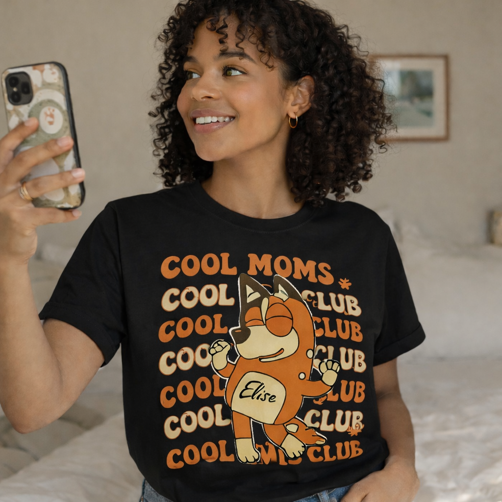 Personalized Black Dog Mom Shirt on Model, Custom Cool Moms Club Apparel with Pet Name Elise, Retro Aesthetic Gift for Pet Owners, Bluey Inspired Graphic Tee, High-Quality Cotton Black T-shirt, TrioAuraDesign Exclusive.