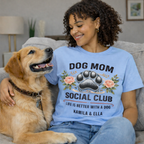 Personalized Light Blue Dog Mom Social Club Shirt on Model with Golden Retriever, Custom Pet Names Kamila & Ella T-shirt, Floral Paw Print Aesthetic, Relaxed Fit Blue Tee for Dog Lovers, High-Quality Printed Apparel, TrioAuraDesign.