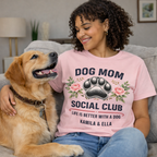 Model wearing Personalized Pink Dog Mom Social Club Shirt while hugging a Golden Retriever, Custom Pet Names Kamila & Ella Tee, Aesthetic Floral Paw Print Design, Best Gift for Dog Lovers, Lifestyle Pet Parent Apparel, TrioAuraDesign.