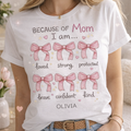 personalized mom t-shirt with bows design, because of my mom i am strong loved quote, custom name Olivia, white Gildan 5000 shirt