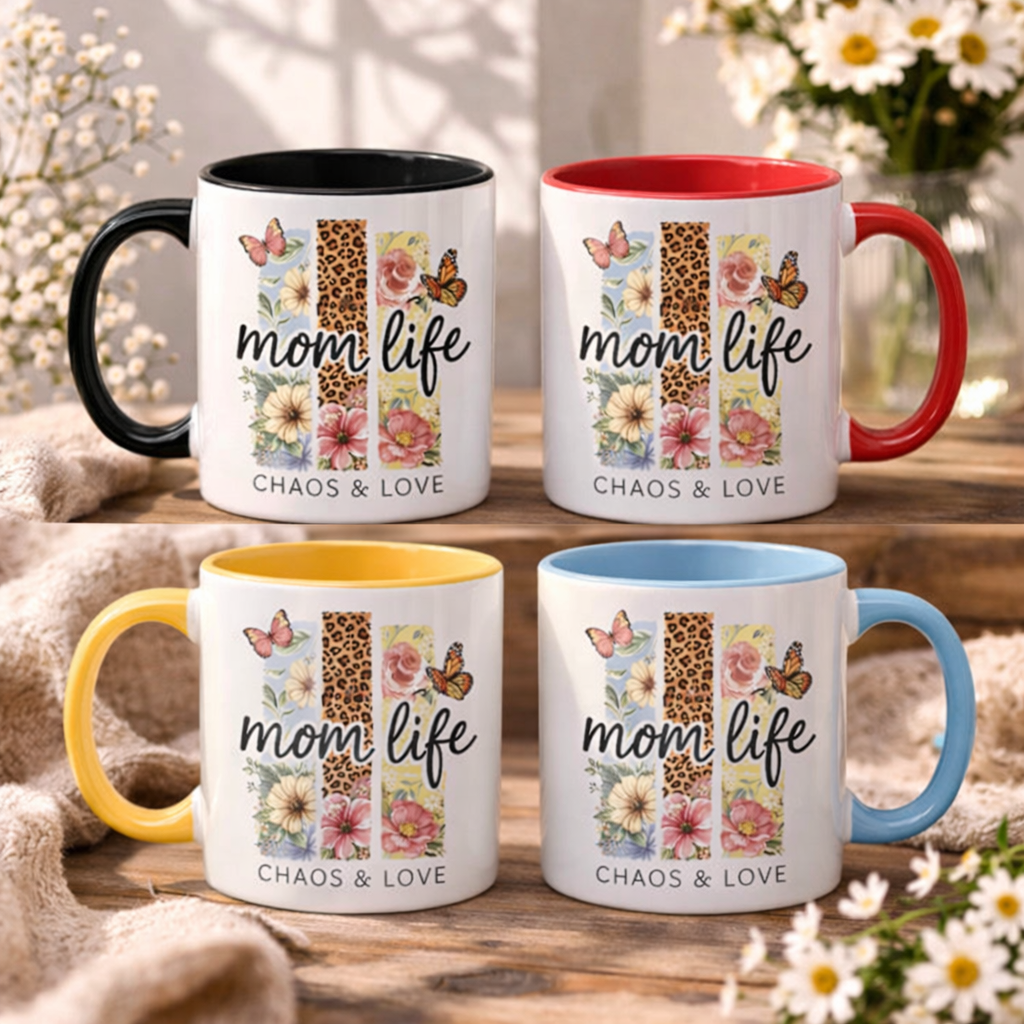 Collection of custom Boho Mom Life mugs with colored handles and rims (Black, Red, Yellow, Light Blue), showcasing the "Chaos & Love" wildflower leopard print, displayed on a wooden surface with a flower background