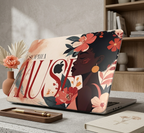 A personalized MacBook case sits open on a modern stone-top desk in a cozy home office setup, featuring an elegant illustration of a Black woman with coral and cream flowers, custom typography SOPHIA MUSE, and a warm beige artistic background with the Apple logo.