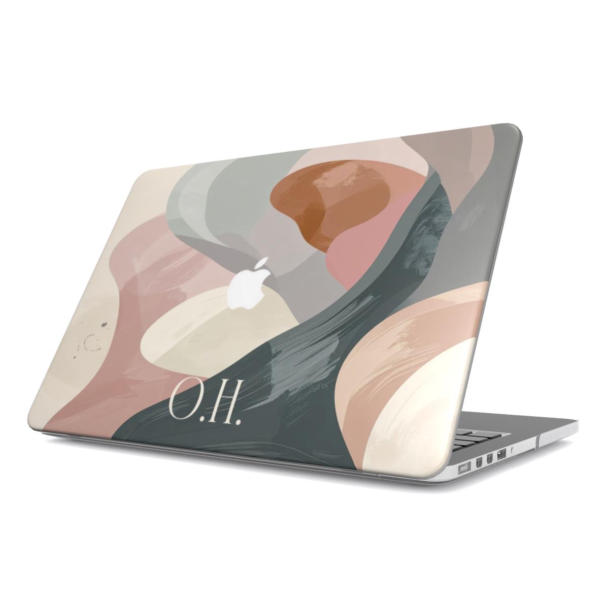 A personalized MacBook case on a plain white background, featuring a modern abstract art design in muted pink, cream, and grey tones with the elegant white monogram O.H. centered at the bottom.
