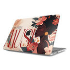 A personalized MacBook case on a white background, featuring a vibrant illustration of a Black woman with coral flowers, custom typography "SOPHIA MUSE," and a warm neutral background with the Apple logo.