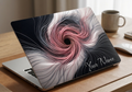Custom name MacBook case with 3D abstract swirl design in rose pink and silver on dark background, personalized with handwritten script name in lower right corner, lifestyle photo on wooden desk
