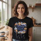 Close-up portrait of a woman wearing a black personalized "Mom Fuel" T-shirt, highlighting the intricate blueberry dessert illustration and custom kids names script.