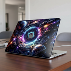 Lifestyle photo of a MacBook Pro on a wooden desk featuring a premium protective hard shell case with a futuristic quantum swirl design. The case displays vibrant purple and blue cosmic nebulae, planets, and a glowing light effect around the Apple logo.