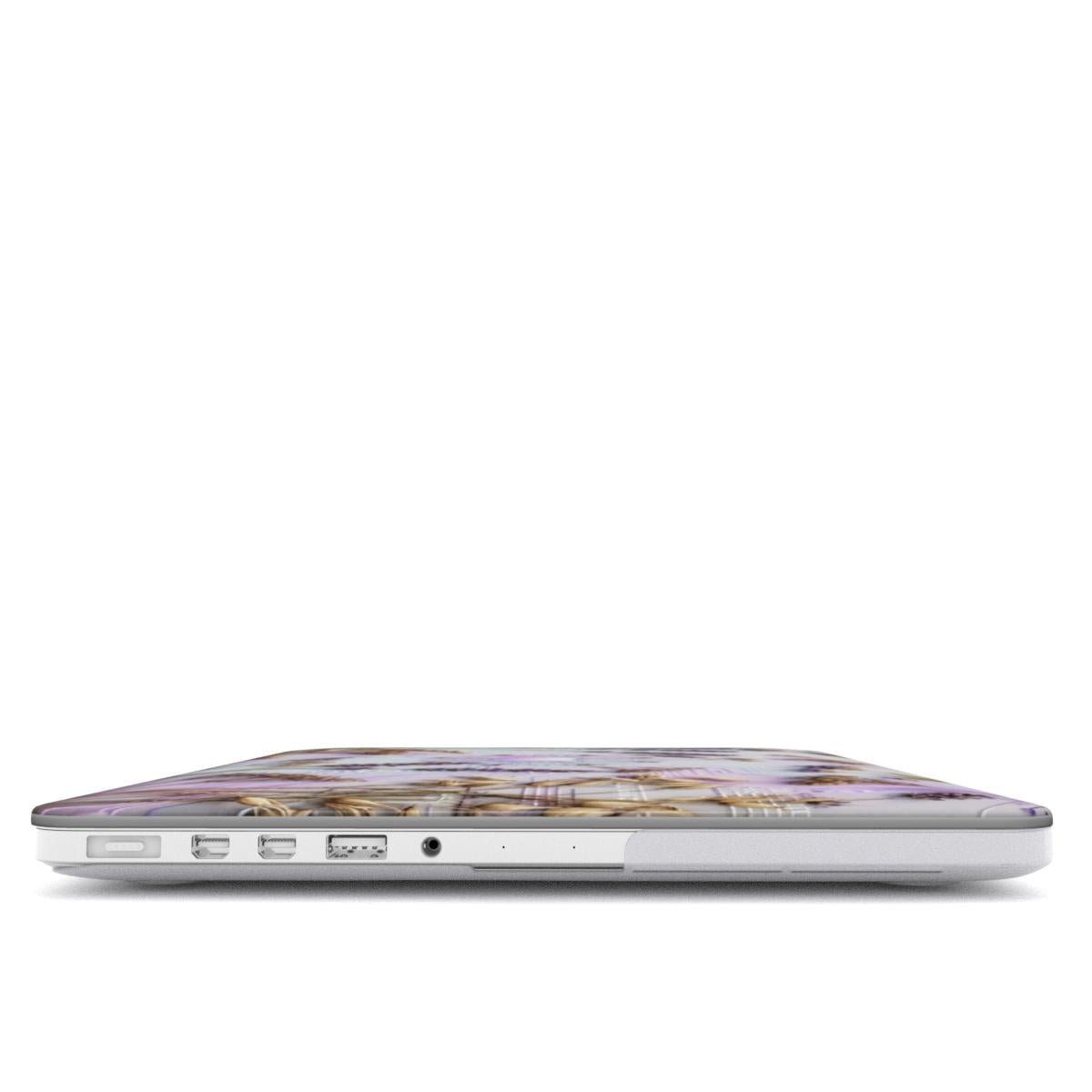 A focused side view of a MacBook wearing a custom purple lavender and circuit board case, showcasing precise cutouts for USB-C, MagSafe, and a headphone jack. The thin protective edges of the case are visible.