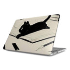 An angled studio shot of a silver MacBook with a cream-colored hardshell case on a white background. The cover features a minimalist black ink sketch of a kitten lying on an open book. This product shot highlights the precise fit of the protective case and its artistic, clean aesthetic.