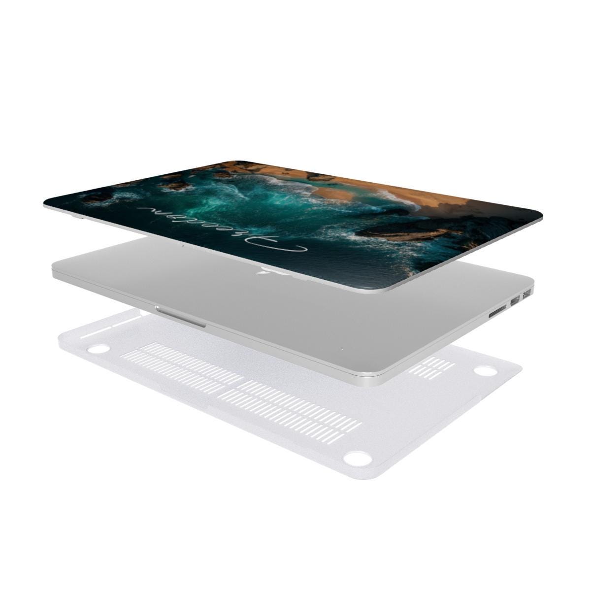 Exploded view of two-piece ocean MacBook hard shell case showing printed top cover laptop and clear vented bottom shell with rubber feet