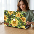 Woman smiling at desk with custom name sunflower MacBook case, personalized yellow floral hard shell laptop cover gift for her