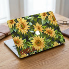 Custom name sunflower MacBook case on wooden desk with books and glasses, personalized yellow floral hard shell laptop cover gift for her