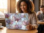 Woman smiling in cafe with custom name stained glass floral MacBook case, personalized purple gold magnolia hard shell laptop cover gift for her