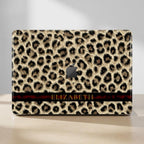 Leopard print MacBook hard shell case with custom name in gold serif on dark red stripe, full cover cheetah pattern, clean product mockup