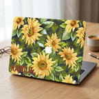 Custom name sunflower MacBook case on desk with coffee cup, personalized watercolor yellow floral hard shell laptop cover aesthetic workspace
