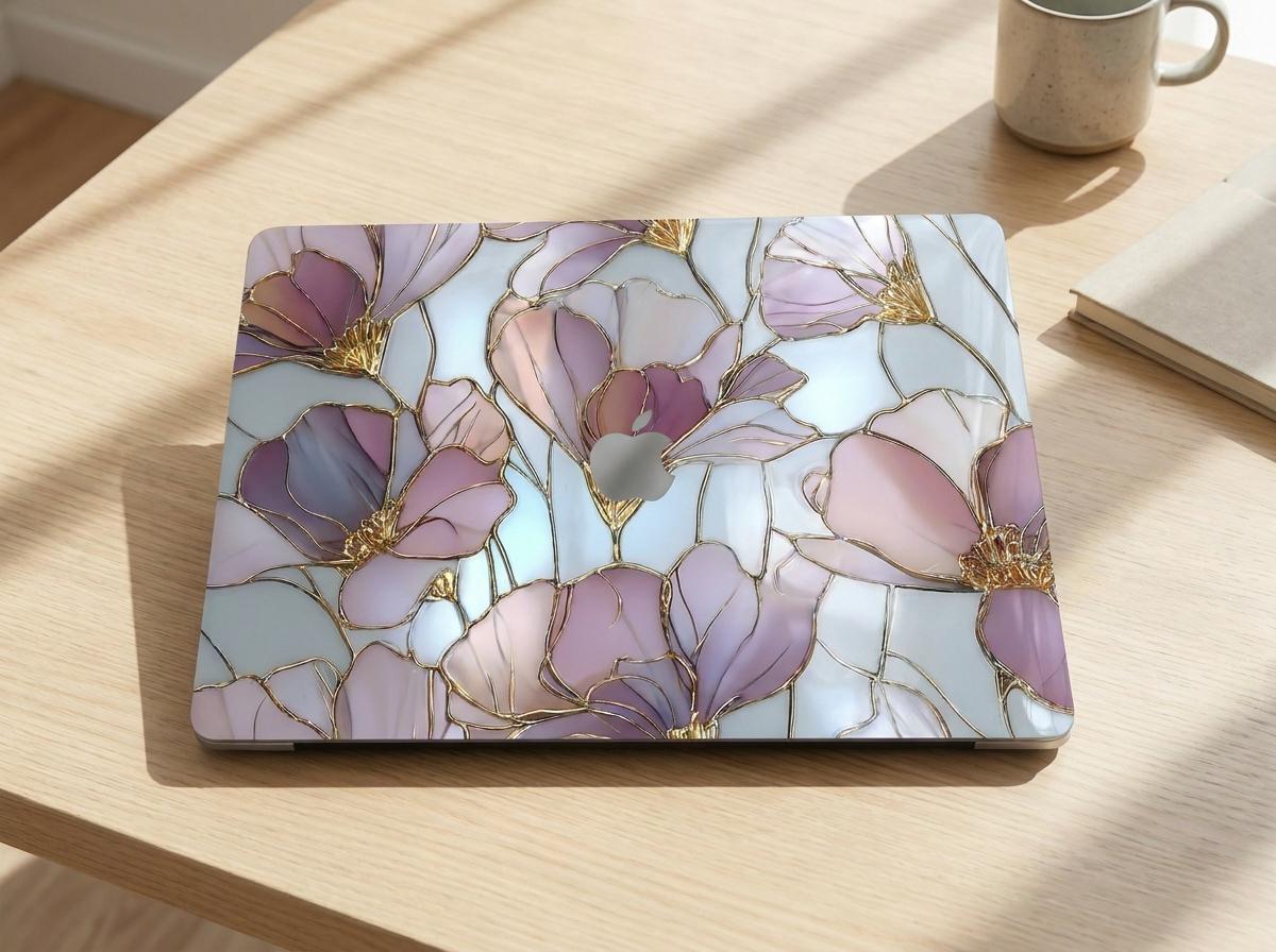 Stained glass floral MacBook case top view on wooden desk with coffee cup, purple pink gold magnolia hard shell laptop cover elegant aesthetic