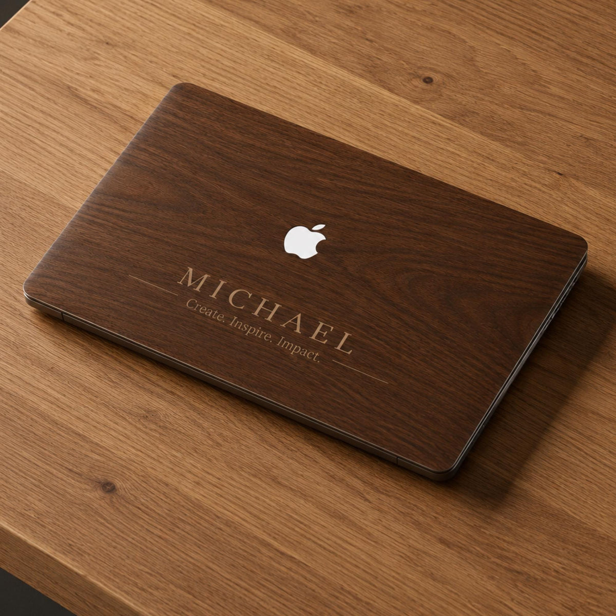 Personalized wood grain MacBook case with custom name Michael and phrase "Create. Inspire. Impact." in elegant serif font. Rich warm walnut wood texture displayed flat on wooden surface, close-up product shot showing engraved style personalization. Hard shell cover for MacBook Air 13 M3 M4, MacBook Air 15, MacBook Pro 14 M5 2026, MacBook Pro 16. Perfect personalized birthday gift, graduation gift or Father's Day gift for him, husband or boyfriend.