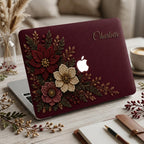 Personalized deep wine Crochet effect floral MacBook case from TrioAuraDesign, featuring rich burgundy, ivory and dusty rose flowers with dark botanical greenery, red berries and gold-toned details. Custom name “Charlotte” appears in elegant gold script at the upper right, with the Apple logo visible at center. Smooth printed hard shell laptop cover with a luxurious dark floral look, available in my shop for MacBook Air, Pro and Neo models.