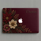 Personalized deep wine Crochet effect floral MacBook case from TrioAuraDesign, shown in a clean top-down product view. The smooth hard shell features rich burgundy, ivory and dusty rose flowers with botanical greenery, berries and gold-toned details, custom name “Charlotte” at the upper right, and a centered Apple logo. Elegant dark floral laptop cover for MacBook Air, Pro and Neo models, available in my shop.