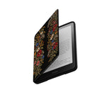 Black Kindle folio case with embroidery effect wildflower print opened at an angle to show the Kindle screen inside