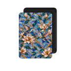 Hummingbird Kindle Paperwhite case front view, blue and opal stained glass effect design with cream magnolias