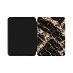 Open Kindle Paperwhite case showing black inner lining and Black Pearl marble front cover with printed gold veins