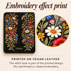Close-up of the printed embroidery effect on the Black Wildflower Kindle case: the stitch look is part of the print on vegan leather, with no real thread or raised embroidery